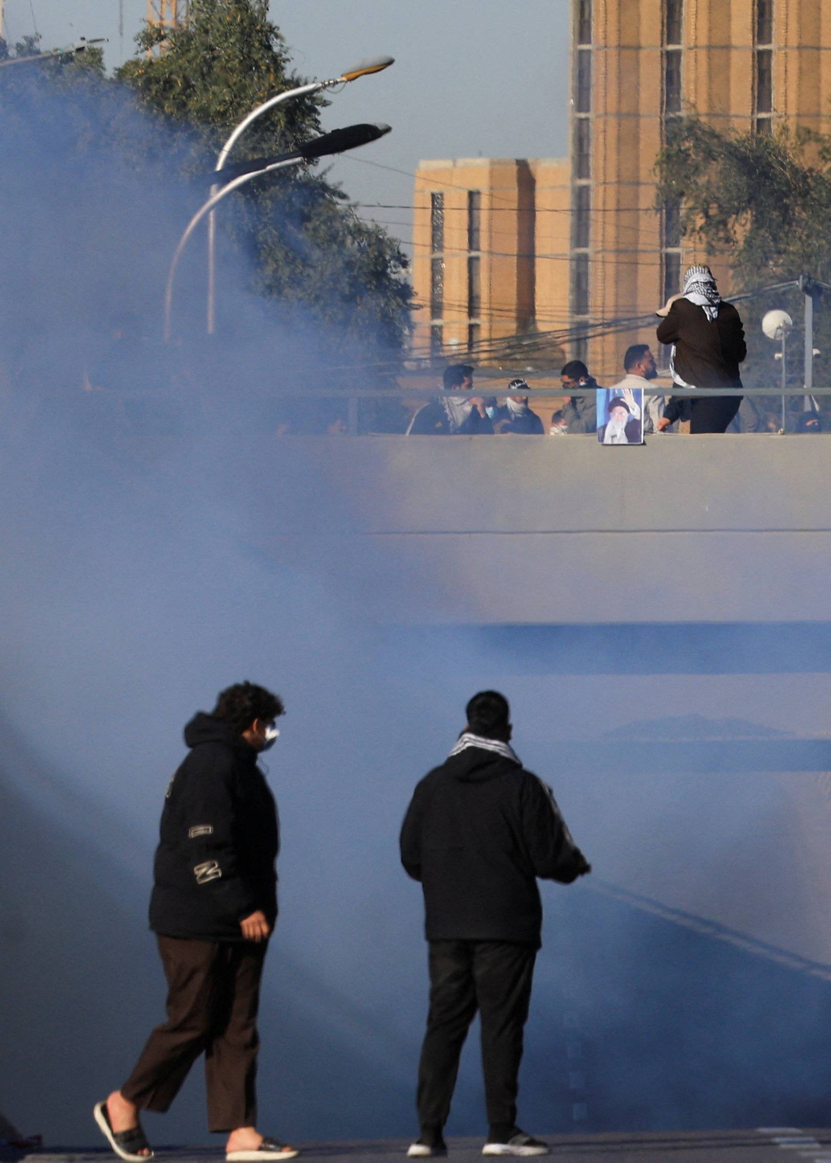 Supporters of Iraqi Shi'ite armed groups gather after the killing of Iran's Supreme Leader Ayatollah Ali Khamenei, in Baghdad